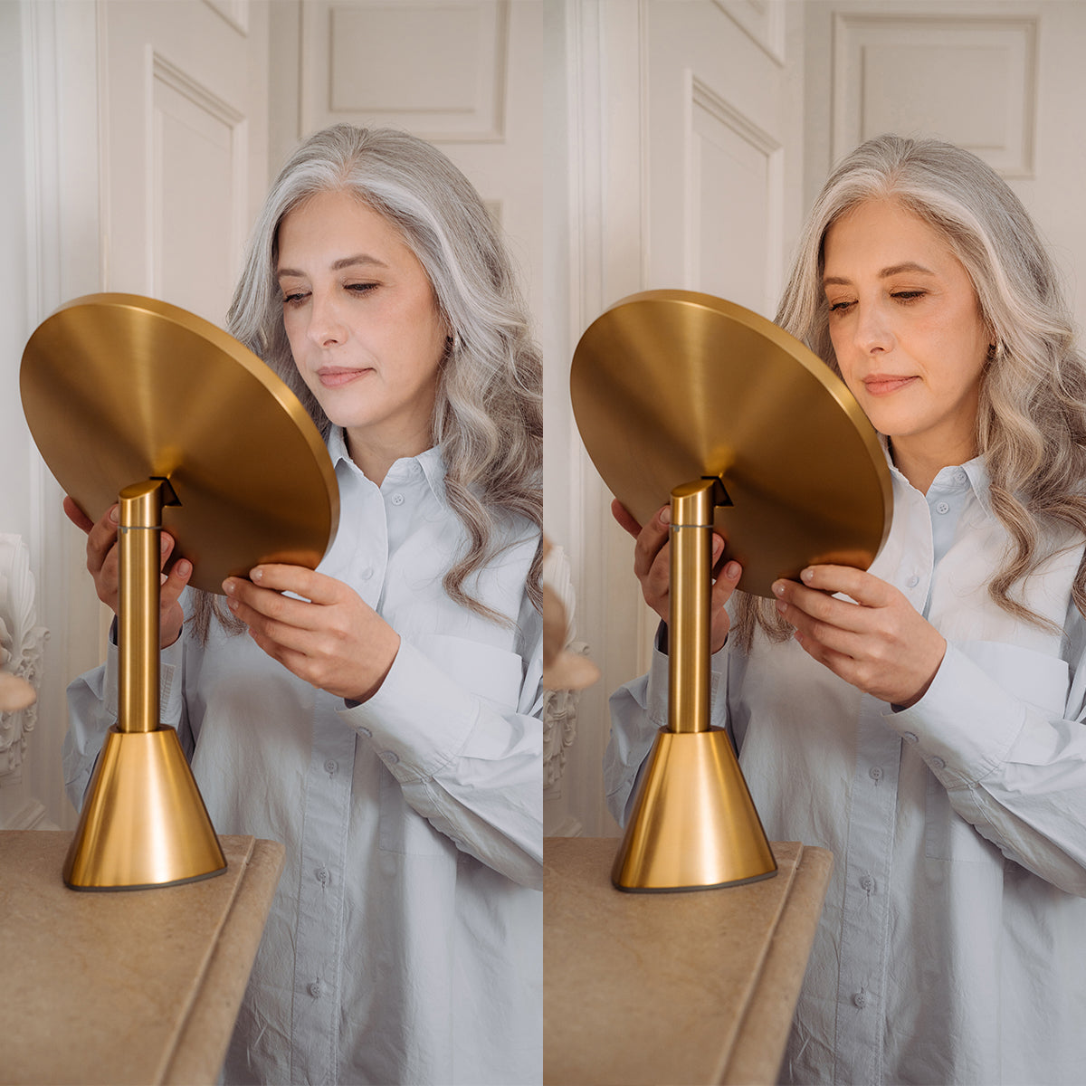Woman holding a gold lighted makeup mirror in front of a neutral background