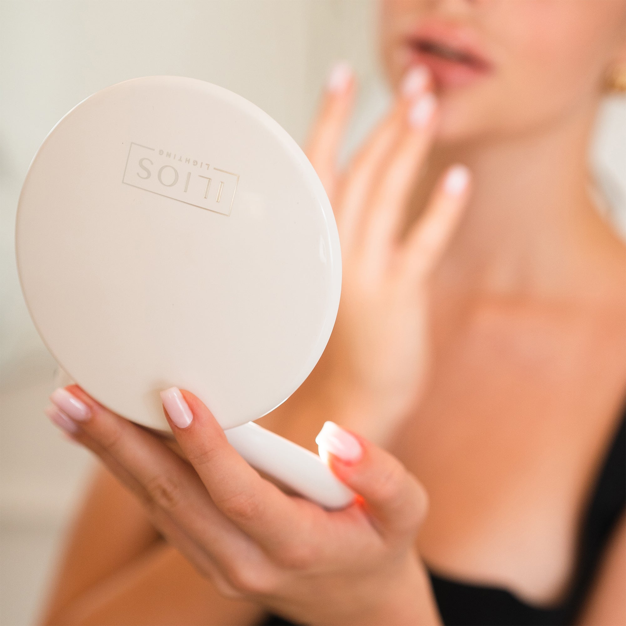 woman_looking_in-Compact_Mirror_#Color_White