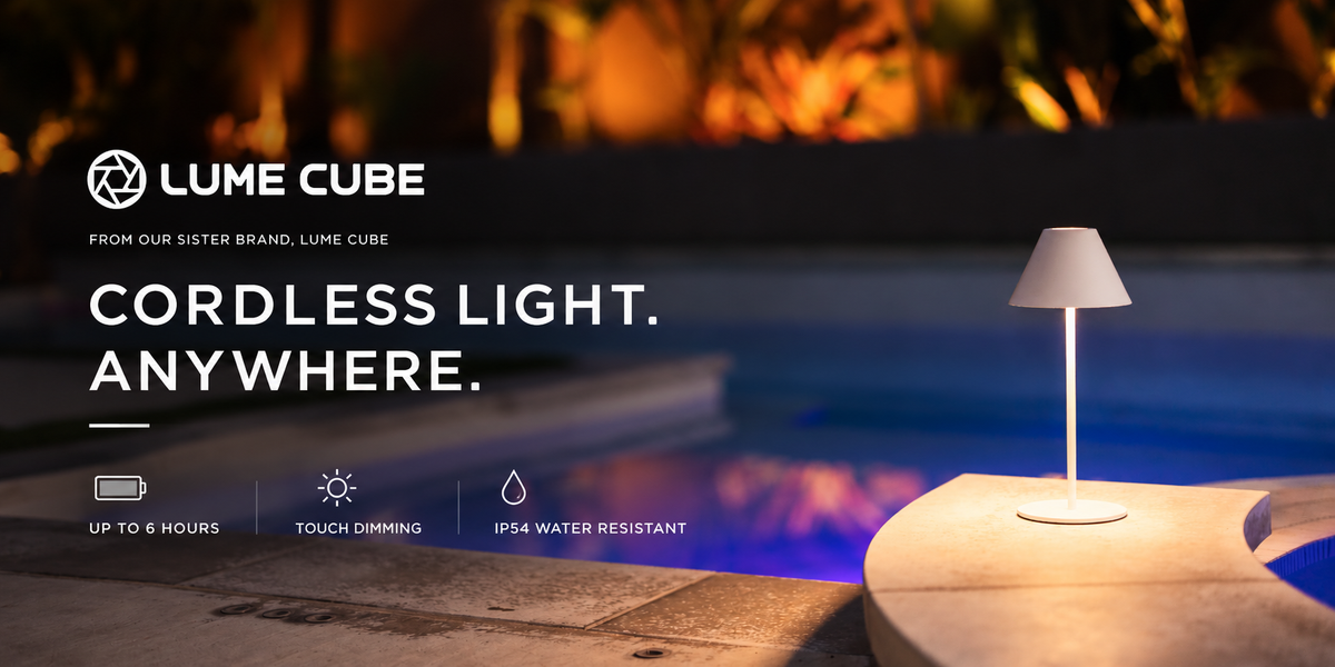 Lume Cube cordless light in a modern outdoor setting next to a swimming pool at night, featuring a white lampshade and a minimalist white base, with promotional text overlays on the left.