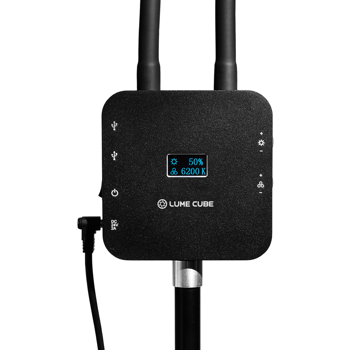 Lume Cube black electronic device with dual antennas, a small blue LED display showing 50% and 6200 K, and a power cable, on a white background.