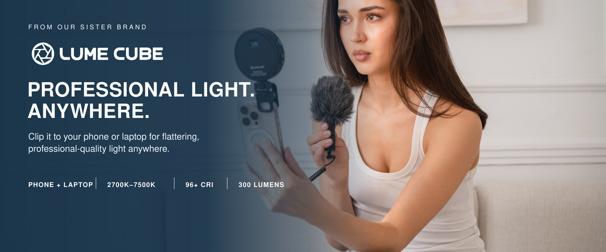 A promotional banner for the Lume Cube, a professional light modifier. On the left, a dark blue overlay features the Lume Cube logo and text reading 'PROFESSIONAL LIGHT.